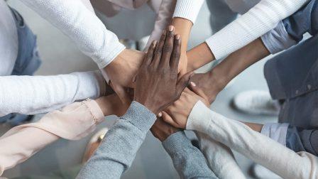 photo of hands joining together